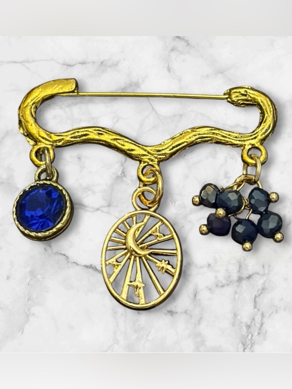 Gold-Tone Celestial Charm Brooch with Blue Crystal Accents